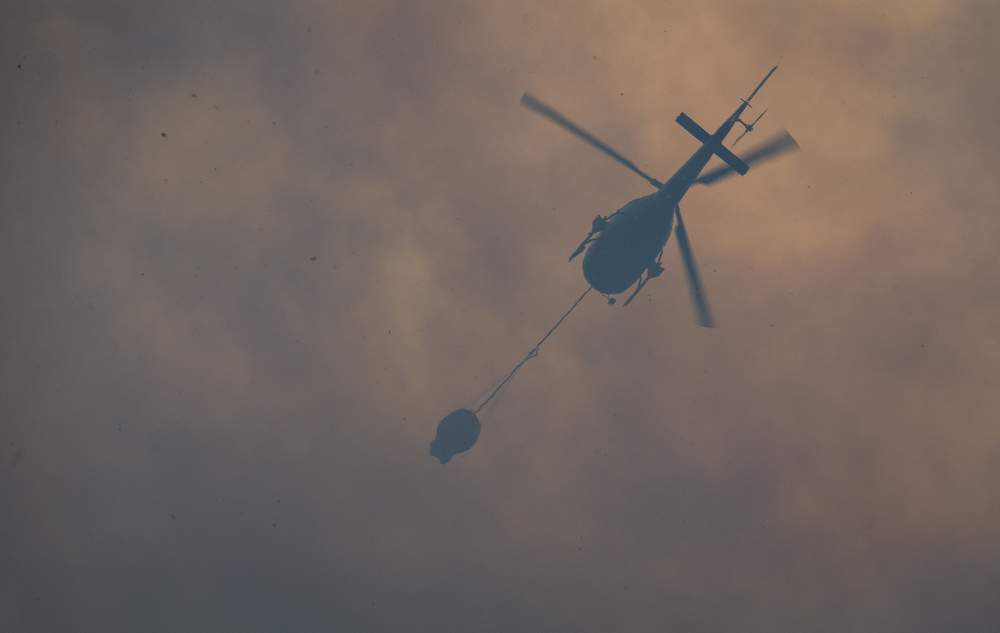 Helicopters made progress, risking their lives amid the smoke.
PHOTO: ALDEN WILLIAMS/FAIRFAX NZ Helicopters made progress, risking their lives amid the smoke.
PHOTO: ALDEN WILLIAMS/FAIRFAX NZ